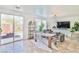 Open-plan living area with dining and outdoor access at 10667 Olympic Pine Dr, Las Vegas, NV 89135