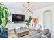 Modern living room featuring a large TV and stylish accents at 10667 Olympic Pine Dr, Las Vegas, NV 89135