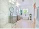Bright and spacious main bathroom features double sinks, a walk-in shower, and a soaking tub at 10667 Olympic Pine Dr, Las Vegas, NV 89135