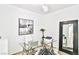 Home office space with a glass desk, stylish chair, and natural light at 10667 Olympic Pine Dr, Las Vegas, NV 89135