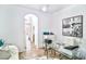 Bright home office with glass desk and arched doorway at 10667 Olympic Pine Dr, Las Vegas, NV 89135