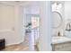 Stylish powder room featuring a modern vanity and decorative mirror at 10667 Olympic Pine Dr, Las Vegas, NV 89135