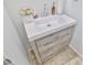 Close-up of the powder room vanity with decorative items and updated fixtures at 10667 Olympic Pine Dr, Las Vegas, NV 89135