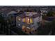 Aerial view of a two-story home with a tile roof and a rooftop deck overlooking a residential neighborhood at 11856 Barona Mesa Ave, Las Vegas, NV 89138