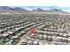 Wide shot of the community homes featuring mountains in the background, desert landscaping, and paved streets at 11856 Barona Mesa Ave, Las Vegas, NV 89138