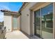 A large balcony has two access doors and overlooks the neighborhood at 11856 Barona Mesa Ave, Las Vegas, NV 89138