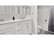 Bathroom featuring dual sinks, a soaking tub, and white cabinetry at 11856 Barona Mesa Ave, Las Vegas, NV 89138