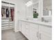 Bathroom features dual sink vanity, walk-in shower, and direct access to a walk-in closet at 11856 Barona Mesa Ave, Las Vegas, NV 89138