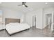 Bright bedroom boasts wood-look floors and easy access to a private en-suite bathroom at 11856 Barona Mesa Ave, Las Vegas, NV 89138