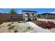 Sarasota community entrance featuring brick arches and desert landscaping at 11856 Barona Mesa Ave, Las Vegas, NV 89138
