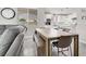 Open concept living, dining, and kitchen with quartz countertops and stainless appliances at 11856 Barona Mesa Ave, Las Vegas, NV 89138