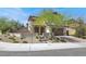 Beautiful single-Gathering home featuring well-maintained desert landscaping and stone veneer accents at 11856 Barona Mesa Ave, Las Vegas, NV 89138