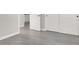 Hallway featuring white trim, baseboards, and wood-look flooring at 11856 Barona Mesa Ave, Las Vegas, NV 89138