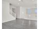 Open concept living room features wood-look floors and neutral walls at 11856 Barona Mesa Ave, Las Vegas, NV 89138