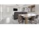 Bright living room features modern gray tones, wood floors, and large windows for lots of natural light at 11856 Barona Mesa Ave, Las Vegas, NV 89138