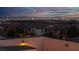 Sunset view of the Las Vegas skyline behind a residential neighborhood with roof top patio at 11856 Barona Mesa Ave, Las Vegas, NV 89138