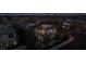 Twilight aerial view of a lighted two-story home in a residential neighborhood at 11856 Barona Mesa Ave, Las Vegas, NV 89138