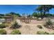Landscaped entrance to The Paseos Park with lush greenery and clear signage at 11856 Barona Mesa Ave, Las Vegas, NV 89138