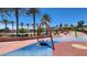 Community park featuring a swing and climbing structure, offering a playful outdoor recreation area at 11856 Barona Mesa Ave, Las Vegas, NV 89138