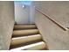Outdoor steps and a metal handrail on a stucco wall leading towards an outdoor area at 11856 Barona Mesa Ave, Las Vegas, NV 89138
