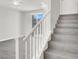 Staircase leading to the upper level, complemented by neutral-toned flooring and an open layout at 11856 Barona Mesa Ave, Las Vegas, NV 89138