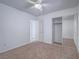 Bright bedroom with a ceiling fan and a mirrored closet at 1424 Heartstring Ct, Henderson, NV 89002