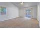 Bright bedroom with a ceiling fan and access to a private outdoor space at 1424 Heartstring Ct, Henderson, NV 89002