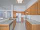 Bright kitchen features white appliances, tile floors and backsplash, and granite countertops at 1424 Heartstring Ct, Henderson, NV 89002