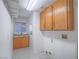 Functional laundry room with ample cabinet space and a sink at 1424 Heartstring Ct, Henderson, NV 89002