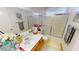 Bright bathroom featuring double sinks, tile floors, framed mirror and a shower-tub combo at 1745 Walingwood Dr, North Las Vegas, NV 89031