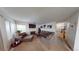 Spacious living room showcasing comfortable furniture, a fireplace, and lots of natural light at 1745 Walingwood Dr, North Las Vegas, NV 89031
