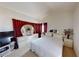 Bright main bedroom with an accent wall, white furniture, and a full ensuite bathroom at 1745 Walingwood Dr, North Las Vegas, NV 89031