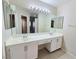 Bathroom featuring a double sink vanity, large mirror, and modern fixtures at 2035 E Warm Springs Rd # 1017, Las Vegas, NV 89119