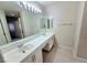 Bathroom showing a double sink vanity with modern fixtures and a large mirror at 2035 E Warm Springs Rd # 1017, Las Vegas, NV 89119
