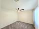 Inviting bedroom with neutral color scheme, plush carpet, and a ceiling fan for comfortable living at 2035 E Warm Springs Rd # 1017, Las Vegas, NV 89119