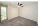 Cozy bedroom with ceiling fan and neutral carpet, ready for personal touches and comfortable living at 2035 E Warm Springs Rd # 1017, Las Vegas, NV 89119