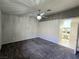 Bedroom featuring plush carpet, a ceiling fan, and adjacent bathroom at 2035 E Warm Springs Rd # 1017, Las Vegas, NV 89119