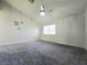 Spacious bedroom featuring plush carpet, a ceiling fan, and bright window at 2035 E Warm Springs Rd # 1017, Las Vegas, NV 89119