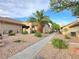 Neat walkway and lush landscaping, with stucco exteriors and desert landscaping enhance curb appeal at 2035 E Warm Springs Rd # 1017, Las Vegas, NV 89119