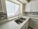 Bright kitchen showcasing a stainless steel sink and modern quartz countertops at 2035 E Warm Springs Rd # 1017, Las Vegas, NV 89119