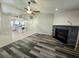 Spacious living room with a fireplace, leading into an open kitchen area at 2035 E Warm Springs Rd # 1017, Las Vegas, NV 89119