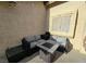 A comfortable patio area showcases a modern seating arrangement with a fire pit table at 2035 E Warm Springs Rd # 1017, Las Vegas, NV 89119