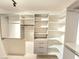 Large walk-in closet featuring custom shelving, drawers, and hanging racks at 2035 E Warm Springs Rd # 1017, Las Vegas, NV 89119