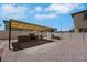 Private backyard features a covered outdoor kitchen and spacious brick patio at 2117 Leatherbridge Ct, North Las Vegas, NV 89081