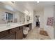 Bathroom with tile floors, soaking tub and glass shower, and double vanity sinks at 2117 Leatherbridge Ct, North Las Vegas, NV 89081