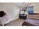 Modest bedroom with a large dresser and bright natural light at 2117 Leatherbridge Ct, North Las Vegas, NV 89081