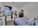Bedroom with window coverings and a view of an open closet at 2117 Leatherbridge Ct, North Las Vegas, NV 89081