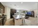 Bright and airy kitchen featuring a large island, stainless appliances, and an open-concept living area at 2117 Leatherbridge Ct, North Las Vegas, NV 89081