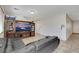 A living room features a large entertainment center and comfortable leather seating, creating a cozy atmosphere at 2117 Leatherbridge Ct, North Las Vegas, NV 89081