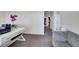 A loft presents a work desk and comfortable seating, complemented by bright, natural light streaming in at 2117 Leatherbridge Ct, North Las Vegas, NV 89081
